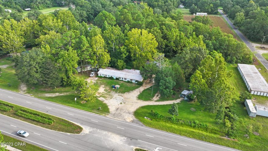 BACK ON THE MARKET - NO FAULT OF THE SELLER! Discover an exceptional investment opportunity within the growing City of Bonifay! This unique property spans just under 2 acres, is strategically situated in the heart of an Urban Mixed Use Future Land Use District, offers a multitude of potential uses including general commercial ventures. The property's standout feature is a massive concrete block building boasting over 4,100 sq ft, providing a versatile canvas for your entrepreneurial aspirations. This building has a brand new metal roof.   Whether you envision sleek modern offices, vibrant retail spaces, or trendy eateries this expansive structure provides the perfect foundation to bring your ideas to life. Multi-family housing is also a viable option, catering to the growing demand for housing in our area.  Benefit from a steady revenue stream as you contemplate your grand vision. The property currently generates rental income from the two single wide manufactured homes (one 3 bedroom 1 bath and one 2 bedroom 1 bath), and the 3 bedroom 2 bath site built home is currently being cleaned out in preparation for new renters.  Situated on busy Highway 90, this property offers unparalleled visibility and accessibility. Take advantage of the high traffic flow to attract customers and clients, ensuring your business endeavors thrive from day one.  Secure your stake in the future - arrange a viewing now to explore the wide array of possibilities this remarkable property has to offer!