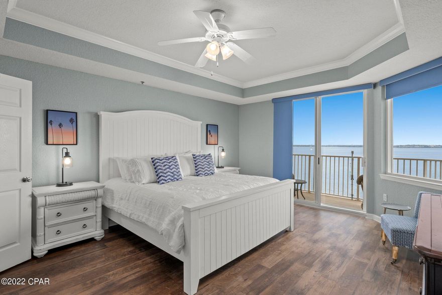 **A Boater's Paradise** This residence is being sold with a BOAT SLIP, new boat deck & 10,000 lb BOAT LIFT!  Hibiscus By The Bay is an exclusive waterfront community located on a 10-acre peninsula along St Andrews Bay with private MARINA & is one of Panama City Beach's best kept secrets! This exquisite 2BR/2BA FULLY FURNISHED turn key residence features a large balcony overlooking St. Andrew's Bay with STUNNING Bay views from the living room and master bedroom with access to the balcony from both and features brand new LVP flooring throughout, ALL NEW kitchen appliances, new window treatments, fresh paint and quality furnishings. Quiet location featuring 625 ft of direct waterfront, convenient to town, only a few minutes to the world's most beautiful beach, unmatched amenities including gated access, onsite gym, library, tennis court, courtyard, a Bay front pool & hot tub, BBQ grills.  Welcome to Paradise!