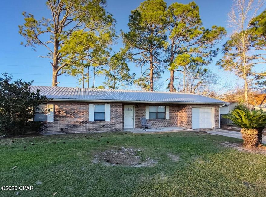 Looking for your next project just minutes from the Gulf? This 3 bedroom, 2 bathroom home is packed with potential and priced for transformation!

Located on a quiet cul-de-sac street, this property sits on a large, private lot with a peaceful small stream running through the backyard, creating a serene natural setting that's hard to find. Enjoy mature landscaping including citrus trees, roses, and various shrubs and trees -- the bones are here, just waiting for your vision.

✔ Metal Roof (2019)
✔ New AC Unit (2023)
✔ Located in an X Flood Zone - No flood insurance required

The home needs cosmetic updates and repairs, making it perfect for:

Investors

Flippers

DIY buyers

Short-term rental potential

A primary residence renovation near the beach

All this conveniently located less than 2 miles from the white sandy beaches of Panama City -- giving you coastal access without the beachfront price tag.

Opportunities this close to the beach, on a cul-de-sac, with major systems already updated and in an X flood zone, don't come around often.

Bring your vision and creativity -- this one is ready for its glow-up!