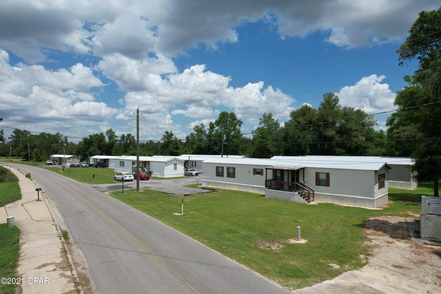 Established mobile home park for sale in a very good location.,  8 mobile homes with front and back porches titles to mobile homes and a survey of the property, all metal roofs all updated very good income. All presently rented.  There are 4 septic tanks.  7200. a month income all 3/2 mobile homes