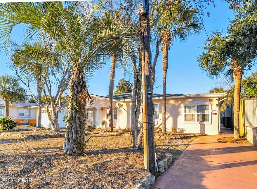 This massive single-family estate, currently operating as the high-performing ''Mighty Paradise,'' offers an incredible investment opportunity just two blocks from the beach and one mile from Pier Park. Designed for maximum occupancy and versatility, the property features a sprawling layout that sleeps up to 24 guests, making it a favorite for large groups and reunions. Renovations include a fully remodeled kitchen, fresh interior paint, and a resurfaced 16x32 heated saltwater pool, ensuring a turnkey experience for the next owner.

Beyond the main living areas, the property distinguishes itself with a dedicated game room equipped with billiards, foosball, and air hockey, plus a private hot tub for ultimate relaxation. Uniquely designed with separate guest quarters that include a second full kitchen and private patio, this estate offers rare flexibility for multi-generational families or groups seeking privacy. With no HOA and a proven history of rental success, this is a standout asset in the PCB market.