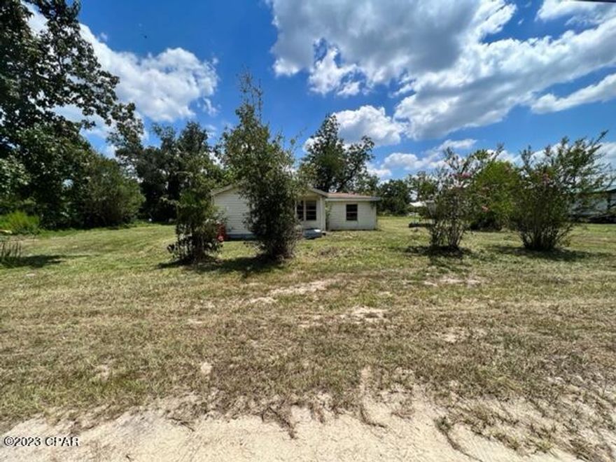 Beautiful lot in Southport that is over an acre! Value is in the land, however, there is a 3 bedroom 1 bathroom home on the property that needs work and would be a great investment opportunity! Septic and well onsite, seller does not warranty, being sold AS IS. Bay County Utilities stated public water is available, tap fees will have to be paid. Buyer to complete due diligence/inspections prior to submitting off