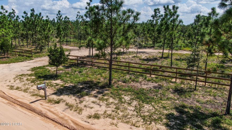 Please view to appreciate! Home site is cleared and ready to build your dream home! Current owner can build your dream house with your plans or he has 10 floor plans you can choose from 1500 square feet to 2700 square feet. Either way build your dream home or  enjoy having a 10 acre get away with RV hook up and use the newly installed septic tank as a dump station. The owner has also added underground power with 50/30 Amp RV service on this beautiful fenced lot. Grow a fantastic vegetable garden utilizing the new 400 foot well! Property also has a fresh water spring that has great possibilities such as creating your very own fish pond or swimming hole.  Owner has additional lot available, separate sale, in Compass Lake. Call David Shearon for any additional information. Do not miss out!