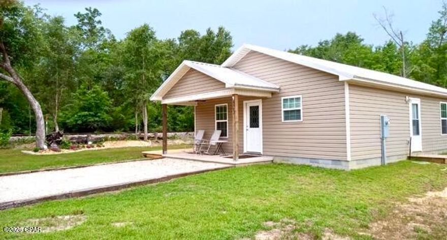 Welcome home to this move in ready spacious 2/2. Tucked in a corner lot in a beautiful and quiet neighborhood.

The home sits on a slab foundation and is located in a quiet neighborhood with paved roads throughout. It features central heat and air for year-round comfort, along with city utilities. Outdoor highlights include a 16x10 patio deck, an 8x10 storage shed, and beautifully maintained landscaping with a flower garden, raised garden bed, plum tree, and berry bushes.

The exterior features a gravel-outlined driveway with parking for up to 4 vehicles, a cozy covered front porch, and an additional uncovered patio perfect for relaxing or entertaining.

Inside, the open-concept floor plan feels bright and inviting with upgrades that go far beyond builder grade finishes. Recent improvements include a large farmhouse-style kitchen sink, updated mirrors, a medicine cabinet added in the primary bathroom, fresh interior paint, decorative trim added above the kitchen counter tops, and a storm door. The home also comes complete with a one-year-old Whirlpool washer and dryer for added convenience. Built with quality and efficiency in mind, this home also features spray foam insulation for improved energy efficiency and PEX plumbing lines for long-term durability and reliability. Because the home is connected to city water, the sellers thoughtfully installed a water softener system for added comfort and convenience.
This home blends modern simplicity, charm, and functionality both inside and out.
Only located ten miles away from Marianna, FL, one hour fifteen minutes to Panama City Beach and fifty minutes to Tallahassee.
SELLER IS MOTIVATED!