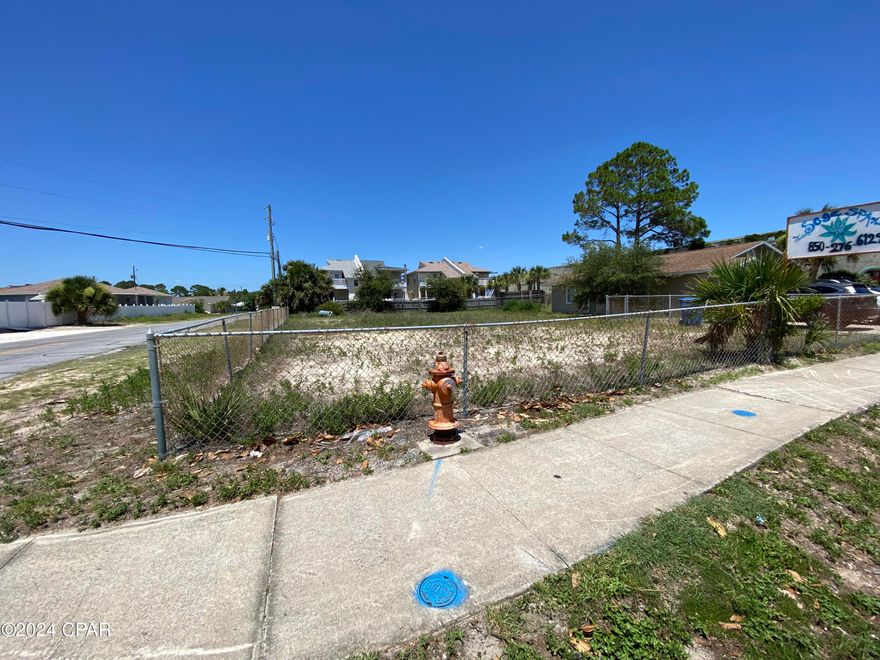 This is a large vacant lot zoned commercial that could have many varied uses for a business, but you will have to check with the County office of planning & zoning about acceptable uses. Cannot infringe upon the tenant's use of the bldg next door at 7402. Owner may be willing to let you put up a fence and reimburse you for the materials. If storing vehicles or trailers there will be a maximum number, with nothing inoperable allowed.