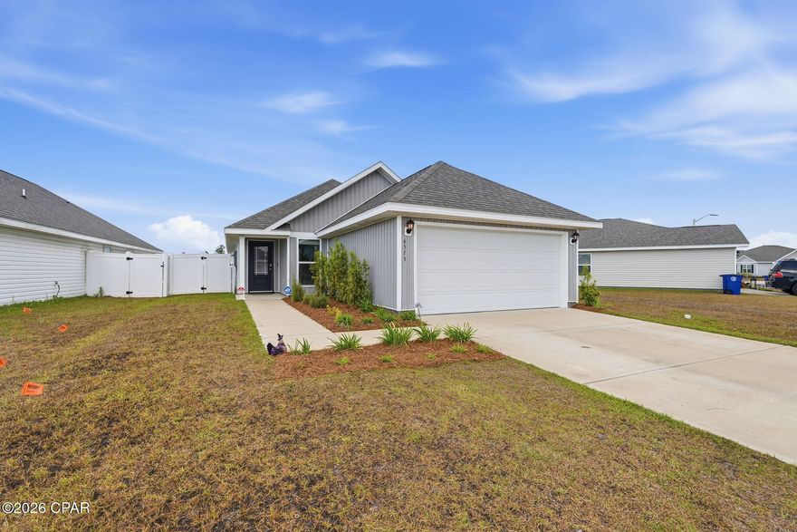 This Celeste floor plan model - like new home is ready for new owners. 6513 Slabinski is a 3 bedroom, 2 bathroom home in Liberty with a pond view and fully fenced in yard! Just a short walk to the amazing amenity center. The floor plan flows nicely from the start. The living area is cozy and inviting and opens to the kitchen and dining area. The master bedroom is located at the back of the home with nice views of the backyard. Double vanity sinks, a soaking tub and stand-alone shower make for a relaxing oasis to enjoy after a long day! There are two additional bedrooms that share a hall bathroom that is easily accessible for guests as well. You will find the laundry area as you head toward the full size 2 car garage. Take advantage of the smart home features including the my-q system that allows you to open your garage with the click of a button. 

Liberty is a walkable community with sidewalks throughout and amazing amenities that simply do not compare to any other community in the area. There is a large resort style pool, community center, gym, playground and splash pad! There is also outdoor grilling to take advantage of. It's truly a lifestyle when you choose Liberty. 

Liberty is located just a few minutes from the new Publix and Starbucks on 231. Just 25 minutes to Tyndall and even closer to shopping and restaurants.