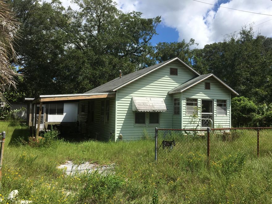 Property and house with lots of potential. Priced to sell - fix up for rental or flip. Double lot located on the corner of East Avenue and E. 1st Plaza, potentially allowing for a second house to be constructed (please check with the appropriate Panama City department). Improvements are being sold ''as-is''. Convenient to schools and shopping. Property Appraiser's web sites suggests there is 1,873 square feet under roof, and 871 Square feet of living space. House includes two large family rooms, kitchen, bath, a multi-purpose room that could be used as third bedroom, and large screen porch. Thank you for considering this property!