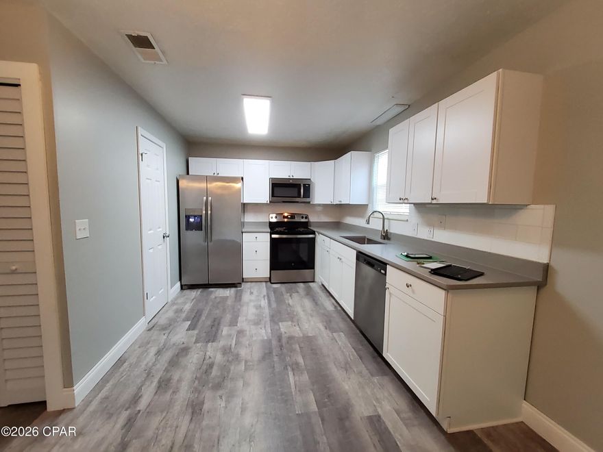 This beautifully updated duplex is located in the desirable City of Lynn Haven and offers excellent rental potential, and excellent Lynn Haven Schools. The property was completely remodeled in February 2022, featuring modern upgrades throughout.

Recent improvements include a new roof (2018), new HVAC system (2022), and a new hot water heater (2025) for added peace of mind.

This unit features new cabinetry, quartz kitchen countertops, stainless steel appliances, and durable vinyl plank flooring. The property also includes a large backyard and a paved driveway with space for two vehicles.

The HVAC system is maintained under a bi-annual service contract, and the property receives quarterly pest control, ensuring it remains well maintained.

The duplex is currently tenant-occupied through November 2026, making it an excellent turnkey investment opportunity.