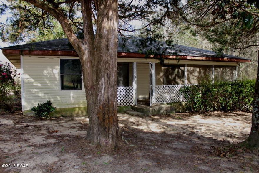 PRICE REDUCED! Cottage style home on 7.27 acres in small country town with great potential!  There is a small pond on the property. You have room for a garden and animals here.  There is a large living room and two large bedrooms. It is just a short distance into Alabama.  It is located in the community of Esto, Florida north of Bonifay, Florida.
