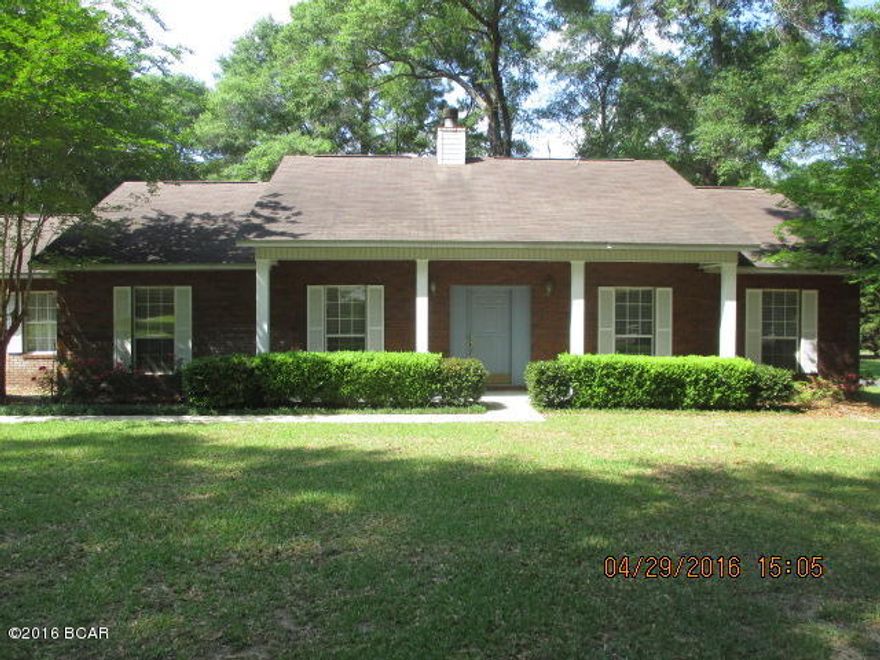 Priced Below Market Value! This Lovely 3/2 Brick home in Indian Springs, a Golf Course Community, has a Beautifully landscaped yard with separate back entrance to the powered workshop. Large screened porch with wooden deck and patio area make  a great place for entertaining. Open living room with Gas Fireplace and laminate wood flooring. Separate Dining Room and Large Kitchen with nice appliances and a new side by side refrigerator. Updated flooring in kitchen and baths and updated light fixtures. Large Laundry Room and the Washer and dryer are included! This all brick home with 2 car garage on a cul-de-sac - What a great place to live!