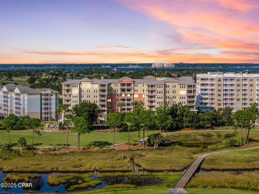 Welcome to The Grand at Bay Point, where tranquility and sophistication converge along the pristine waters of St. Andrews Bay. Designed for those who seek more than a residence, this exquisite bayfront retreat offers a lifestyle defined by serenity, privacy, and effortless luxury. Walls of glass frame sweeping water views, while the open-concept design flows seamlessly between living, dining, and culinary spaces, creating an atmosphere of understated elegance. The owner's suite is a sanctuary of calm with panoramic bay vistas and a spa-inspired bath, complemented by two gracious guest suites that welcome family and friends with comfort and style.

Life at The Grand is one of rare seclusion, enhanced by curated amenities that enrich daily living without ever intruding on its quiet rhythm. Begin mornings with a round at the championship Nicklaus Golf Course, unwind at the full-service spa, or simply watch the sun set over the bay from the resort-style pool. For the boating enthusiast, a newly built deep-water marina offers effortless access to the Gulf, placing endless coastal escapes within easy reach.

Tucked within the prestigious, gated Bay Point community of Panama City Beach, this residence captures the essence of private coastal living—an invitation to a slower pace, a refined atmosphere, and a home where every detail reflects both elegance and ease.

*This unit comes with an extra storage unit and reserved parking spot #39
