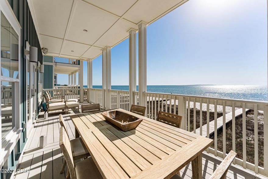 UNDER CONTRACT ~ TAKING BACKUPS! This is undoubtedly one of the nicest houses you'll find from Mexico Beach to St. Joe Beach. Everything in this home is custom and top of the line. The high-end finishes start in the foyer with high-end dirty top pine floors and well-appointed elevator and are found from top to bottom with no expenses spared. You'll find Wolf appliances, marble countertops, designer lighting, Restoration Hardware furnishings and much more. The entire 4th floor is a master bedroom with a sitting area and bath that's to die for with marble floors, soaking tub, huge closet, double tiled shower and more. Each floor has a large deck overlooking the Gulf. All bedrooms have en suite bathrooms and this home is being sold fully furnished and equipped with a small list of exclusions. Check out virtual tour! Check out virtual tour!