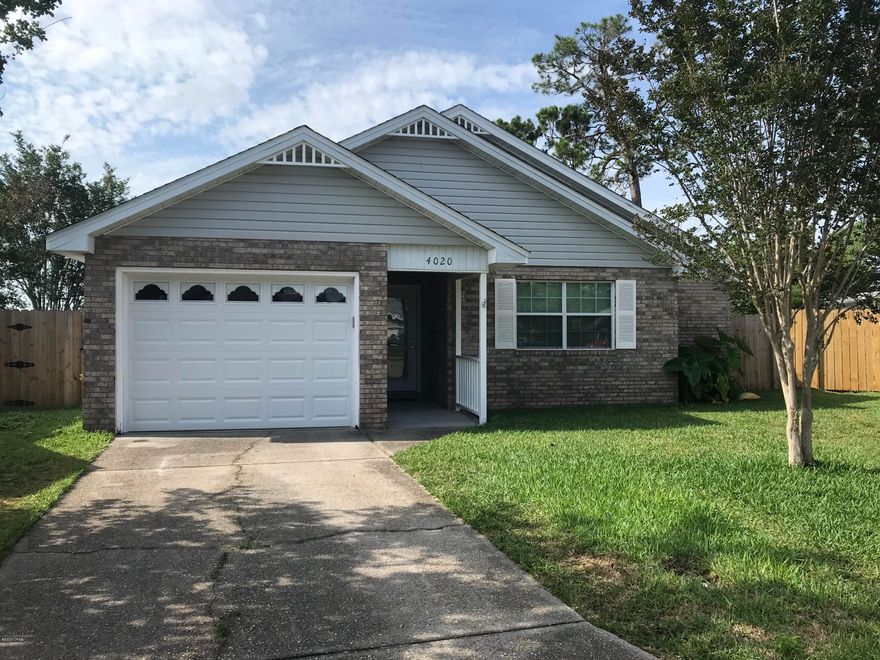 'CURRENTLY UNDER CONTRACT, SELLER ACCEPTING BACKUP OFFERS. This 3 bed, 2 bath home has been meticulously maintained and is move in ready. Located just off of Hwy 390 on a quiet cul de sac, it is convenient to both Lynn Haven and Panama City. The home has a split floor plan where the bedrooms are divided by a large living room, complete with fireplace and vaulted ceiling, and the bright, light kitchen/dining area. The master bedroom has its own bath and walk in closet. The sizable laundry room is handy, located just off the kitchen. The kitchen is equipped with a quartz counter top and a two year old refrigerator. There are brand new french doors from the eating area which lead to a side covered porch. The lot is completely fenced (all new) and is large enough to meet many needs. It also boasts a new roof and hot water heater.