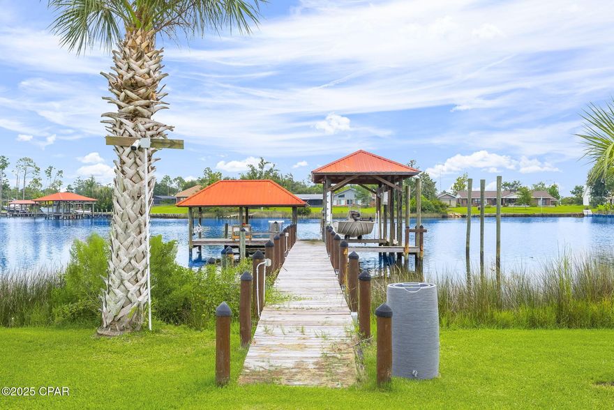 Back on the Market due to buyer not performing per the contract.
Welcome to 7122 Bay Crest Rd.!  Here's your opportunity to own this wonderful Water Front Home, your new Florida Coastal Oasis! This home is nestled on shores of Gainer Bayou with direct access to North Bay and then to St. Andrew Bay or the Gulf for all your Salt-Water boating activities! 
This location is conveniently located with access to the airport in about 15 minutes, beautiful sandy white beaches of Panama City Beach in about 25 minutes, Tyndall AFB in about 30 minutes, and you'll be shopping in Lynn Haven in 10 minutes! 

Situated on .725 acre, fully fenced, this property offers 100 ft of waterfront with a covered fishing dock with fresh water and electricity, low voltage lighting, fillet table, rigging station and rod holders. Next to this is the covered boat dock with lift, and another boat docking space next to it. Closer to shore there is a platform where you can access/park your jet skies or kayak!
Next you'll find the detached studio, mother-in-law or guest quarters which also has a nice deck facing the water and includes living/dining/kitchen area, bedroom, and bath!
Moving on, you will find a nice relaxing saltwater pool, a large open deck and nice screened in room. The perfect place to sit and enjoy the shimmering waters and natural beauty this property has to offer!  
The home is approximately 2329 sq ft. featuring an amazing great room with a wall of windows overlooking the beautiful backyard and water views, this is open to the spacious living room with a wood burning fireplace and built-in cabinets and shelves, and to the kitchen and dining area with granite countertops, stainless steel appliances and a nice island for easy dining or prep space!  As you enter the home you will see a large foyer area that could easily be used for you additional space needs.  Go to the left and you will have the guest bath and a large guest bedroom (this was 2 bedrooms and can be converted back if needed). 
Wake up to breathtaking views every morning from the primary suite with double doors leading out to the back deck overlooking the pool and the Bayou! The primary ensuite features a double sink vanity, separate shower and jetted tub!
The laundry is located in the hall adjacent to the kitchen, and the garage has a workshop with a/c.  There is covered parking as well that can easily accommodate 2 large vehicles located in front of the garage.  You will also have a separate 10 x 20 storage building with loft shelves on each end of the building.
There are many more features to this home you will surely love so call your favorite Realtor today to schedule your private showing!
Thank you for considering this incredible property!  All information and measurements should be verified by buyer or buyer's agent if important.