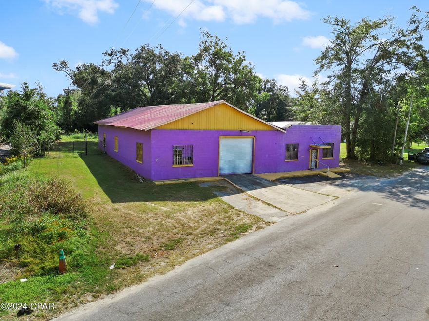 Under Contract Taking Backups. Excellent Location and Opportunity to move or start you business. formally a Tire Store with a  Large Garage 79 X 40 and 30 X 29 Office. 22 X 22 attached 2nd Office Area, Air Compressor, oil container, and 3 car lifts, condition unknown.. Painted in the Marianna High School colors. Area ready for your improvements and upgrades.