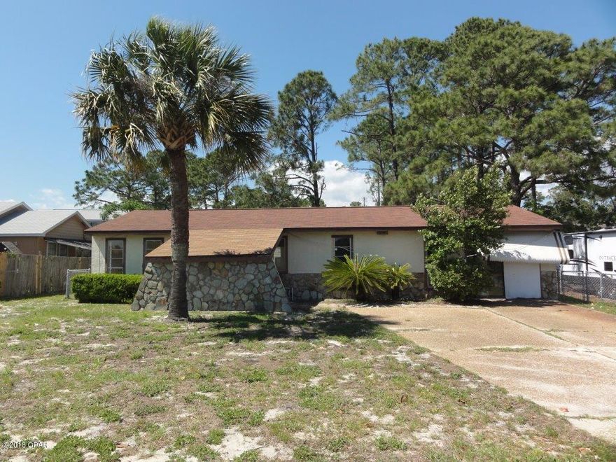 Beautiful home in Gulf Highlands! Stone accents! Spacious living room! Separate breakfast/dining area! Kitchen features dark stain cabinets and breakfast area! Master bedroom includes walk-in closet and private master bathroom! Two spacious secondary bedrooms share a full bathroom! Bonus room could be perfect office, guest room, or playroom! Sunroom for relaxing! Level lot and fenced backyard! Detached garage for more parking, storage, or workshop! A must see! Submit your offer today!