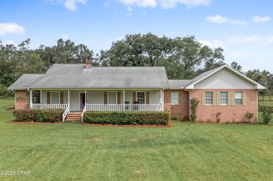 Back on the market!  Very motivated seller!  Beautiful home with private valley setting.  Long crepe myrtle lined driveway.  Sitting one 39.5 (+-) beautiful acres.  12 miles south of I 10.  35 Minutes to Panama City Beaches.  Few short miles to the Choctawatchee River along with creeks and springs.  
Includes a nice sized barn wired with electricity and an enclosed ''insulated'' workshop with windows and doors.  Luscious green pastures for cattle or horses.
Home has a large country front porch overlooking a large front yard.  Patio deck on the back of home.  Open floor concept for living and dining areas.  Ceiling to floor fireplace in living room area for cozy winter nights.  
Very large Master Suite with lots of natural lighting.  Includes a sitting area, large, heated and cooled walk-in closet.