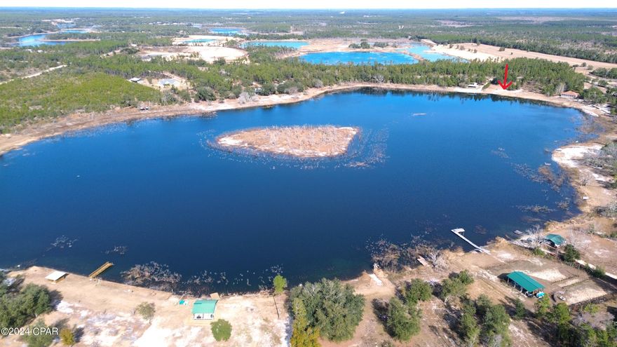 Waterfront Property on Little Island Lake! Almost 2 acres available for purchase on boatable, Little Island Lake. Boat, Fish, Wave-runner, wakeboard, canoe, paddle board, you name it! Be active on the water or just enjoy a calm, quiet day in your backyard at the lake. Spring-fed with a white, sandy bottom and a white sandy shoreline. Get away from the rush of town discover the undiscovered Little Island Lake community. No HOA, build your dream home or weekend getaway or just put a pavilion or pole barn to enjoy the shade while visiting the lake. Many options and many opportunities. These parcels do not come available often, take advantage today!
