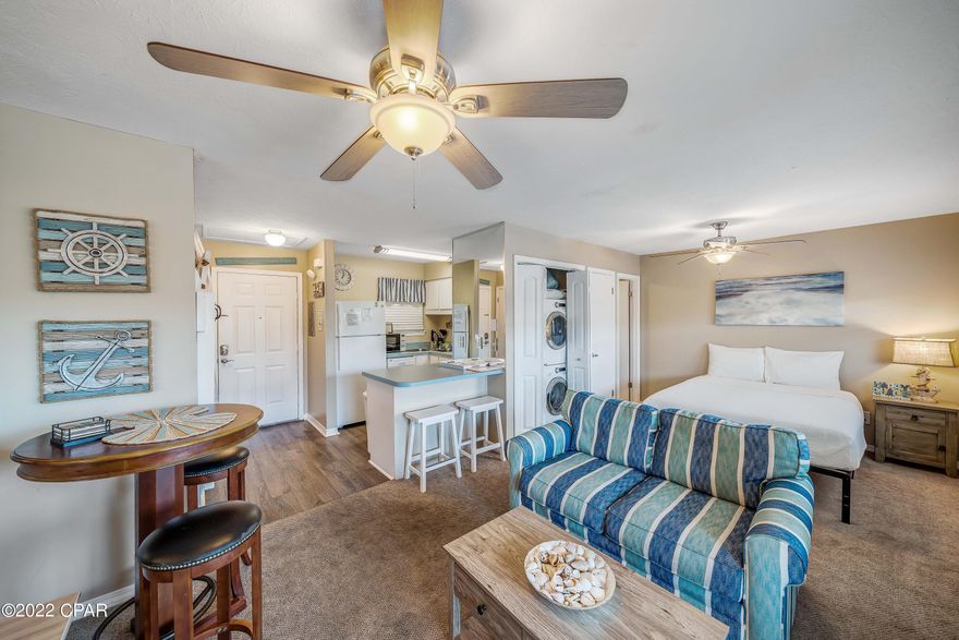 2021 Gross annual rents $27,190.79 and Year To Date 2022 Gross Rents $18,810.94 Gulf Highlands Beach Resort is centrally located on Panama City Beach with a Gulf Front Club House and Pool across the street. There is a traffic light crosswalk to cross the street safely right outside the back gate. This Resort has so much to offer including, gated entry, 18 hole mini golf, 4 tennis courts, 11 pools, exercise room all included in the HOA dues. Short term rentals are allowed as this unit is currently booked solid with the current management company. The Resort is within walking distance or a short bike ride to bowling, skating, arcade, a trampoline park, fine or casual dining, nail salons , the post office and Walmart. This upstairs efficiency unit has been very well taken care of.  Verify measurements if important.