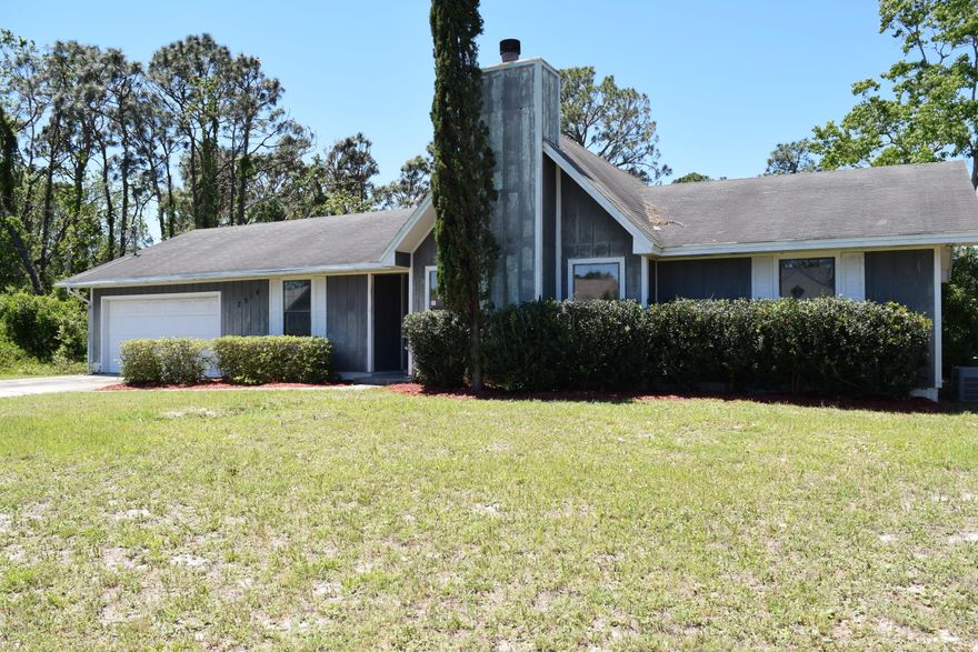 Split floor plan home with spacious back yard. The home is centrally located on Panama City Beach close to the sandy white beaches and convenient to Panama City. The home features a large living room with a fireplace open to the dining area and a very spacious master bedroom. There is a huge concrete open patio area in the back making it real easy to grill and chill in the backyard with friends and family. The kitchen also has an eat in breakfast nook area and there is an interior laundry room.