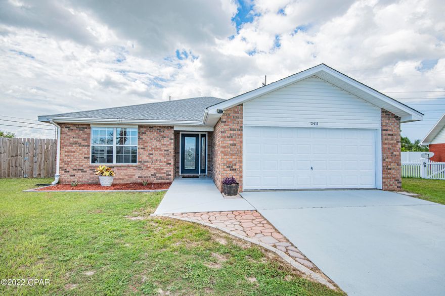 CURRENTLY UNDER CONTRACT, SELLER WILL CONSIDER BACKUP OFFERS- 3 bedroom 2 bath brick home on very large fenced lot convenient to Tyndall in Brentwood Estates. Split floor plan in neutral colors,  high ceilings, fireplace and crown molding in main room, a spacious kitchen with farm sink, breakfast bar and tons of cabinets and wood counter space.  This home also offers a dining room convenient to kitchen and French doors that open to a courtyard patio. Spacious master bedroom offers walk in closets and master bath with dual vessel sinks, frameless walk in shower and built in shelving. Laundry room too! Home has a new roof, New energy efficient water heater (2019), New HVAC (2018). With a spacious two car garage and long driveway, this home has space for multiple vehicles.  Make your appointm