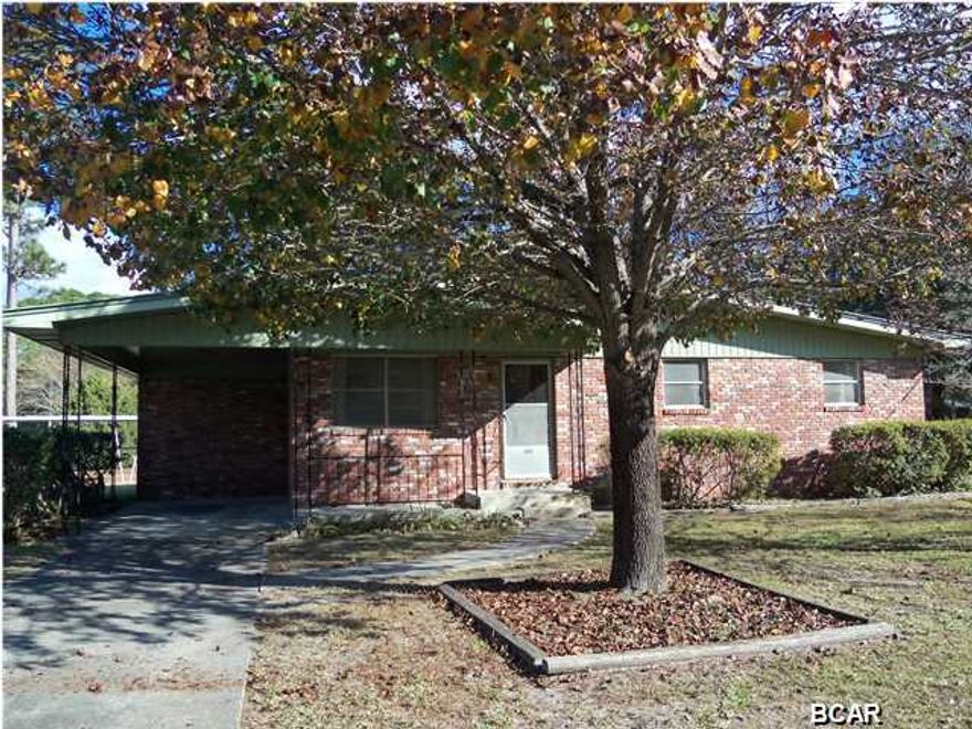 Lovingly maintained all brick home on large corner lot in Lynn Haven. Very, very good condition. Roof replaced in 2004. Original hardwood flooring (even under the carpeting in the living room). This 3 bedroom, 1 bath home is sure to impress you. Huge enclosed porch. Large laundry room off of the back porch. Double corner lot, landscaped and very pretty. Home has an attached carport, additional carport in the side yard (accessed by double gates). Don't miss your opportunity to view this lovely home. (all sizes approximate and taken from public records, buyer to verify any details buyer deems important).