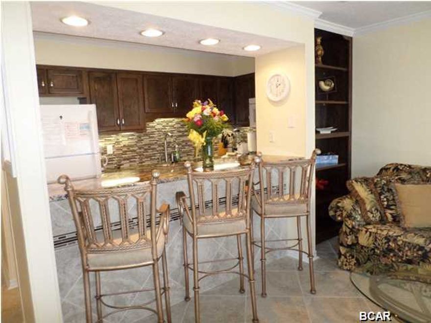 PRICE JUST REDUCED AGAIN!! $17,000 !!!! MOTIVATED SELLER BRING ALL OFFERS! BETTER HURRY THIS ONE WON'T LAST LONG! ONE BUILDING OFF OF THE GULF. NEED CASH BUYER, Gulf front complex with one building beachfront and four buildings surrounding the heated pool. This building is the one that is closest to the beach and in high demand! The fall of 2013 completely renovated!! Paint, hand crafted cabinets, under cabinets lighting, backsplash. Ceiling fans installed and all lighting updated. Exotic granite, can lights above the breakfast bar, 18'' tile throughout the entire condo. Leather recliner, queen sleeper sofa. King mattress and box springs. Nice safe family complex with a clubhouse, heated pool, and just a very short walk to the beach from this unit. Perfect for weekend get-a-way or a