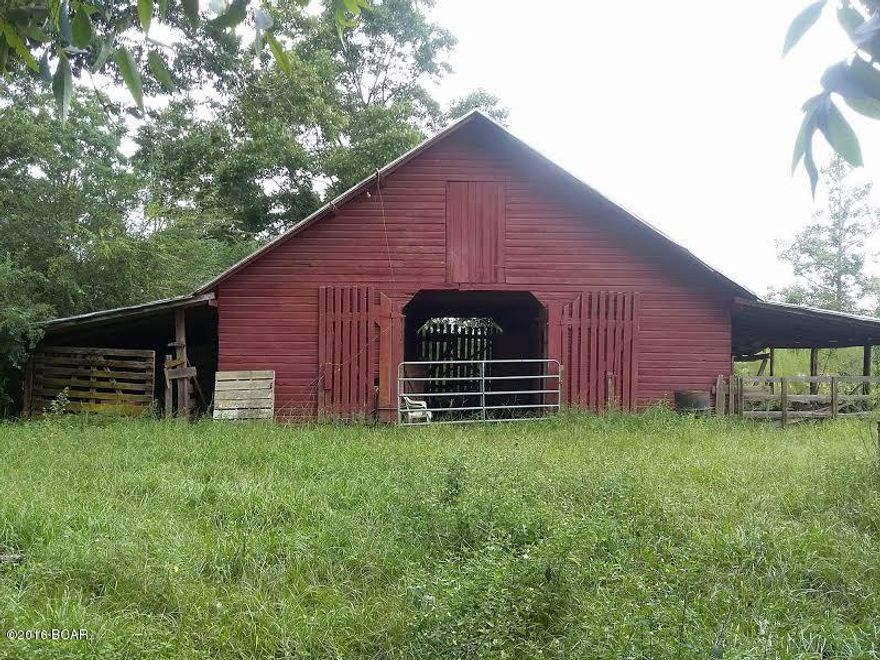 This cute country farm house sits on 5.31 acres just south of Chipley.  The property is absolutely beautiful with magnificent trees shading the home.  It is perfect for horse lovers or farming with 2 barns and 2 silos included in the sale.  The home needs a little TLC but has the charm and appeal you will be proud of when it's complete, including hardwood floors, pine paneling, and a big front porch to sit and relax.  All this and it is a steal at this price!  Call to see this one before it's gone. (Room measurements are estimates only.  Buyer to verify if important.)