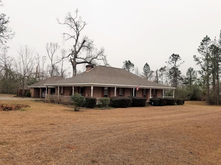 CURRENTLY UNDER CONTRACT, SELLER ACCEPTING BACKUP OFFERS. Beautiful 3 bedroom, 2 bath Ranch style home located in a well established neighborhood. Home has beautiful new bamboo flooring and ceramic tile throughout home. Large living room with surround sound and a wood burning fireplace for those cold nights. Crown molding and chair rail throughout the home with new light fixtures. Enjoy cooking in the updated kitchen with new laminate counter tops. Outside you will find a covered porch that is partially screened in. There is underground electricity that goes out to the covered carport. In case of power outage there is a generator plug on the outside of the home. Just minutes from town and the new high school. Call for your appointment today. MOTIVATED SELLER