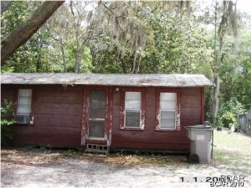 This home on about 2/10ths of an acre is approximately 2.5 miles to the airport. The home is old but clean and comfortable. It would be great for someone working at the airport. The property is also ideal for someone wanting a fishing cabin. The lot on which the house is located goes back to approximately 2.75 acres offered with this, all for the one price. The total package is approximately 3 acres. Please view the parcel map on the property appraisers web site for perspective as the boundaries on the acreage are not clearly marked. All measurements are approximate. Buyer is to verify.