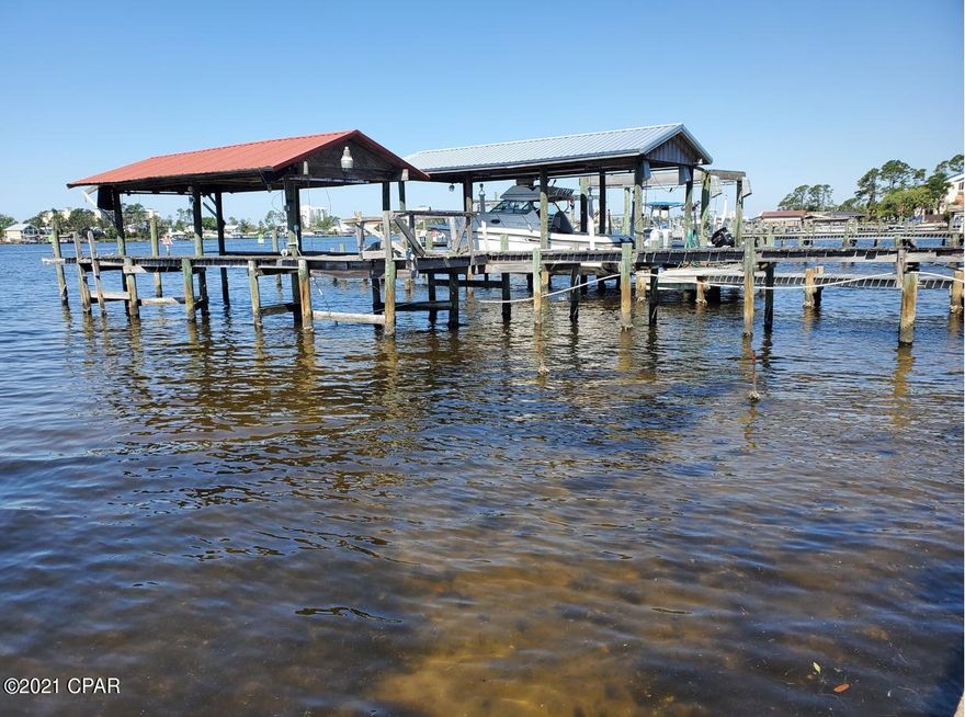 Location, location, location! Deep water access. Enjoy Beautiful sunsets across the lagoon. Property within walking distance to some of the best restaurants on the beach. Pilings for dock present. This home is being sold ''as is''. Great location to renovate existing home, or for building new home. Could be a great investment to build income producing duplex or triplex. All measurement are approximate. Verify if important.