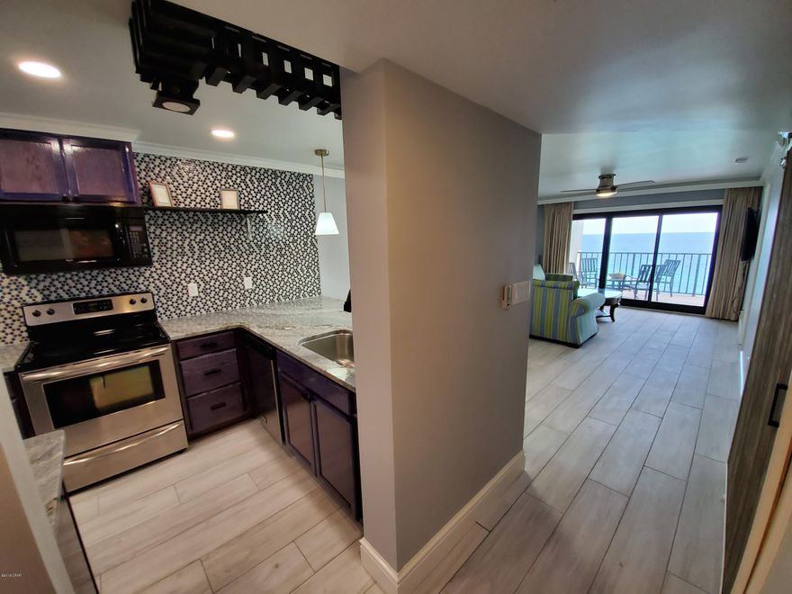 Take a look at this stunning 1/2 Waterfront unit in The Commodore. 

This recently renovated unit is absolutely gorgeous.  

Every inch and detail has been meticulously done, with all new kitchen and baths. Cabinets, counter tops, flooring, paint and more. 

This fully updated unit is ready for new owners. 

With spectacular Gulf Front views. From the living room to the bedroom with Patio access in both. 

This unit comes fully furnished and is Turnkey for you. 

If you are looking for Gulf Front living on the East End of PCB.  This is one to see.



Additional Unit and Building information found in the ''more'' Tab. Here is the information for the Commodore Building
(1) Brand new roof on the building 
(2) Whole building Is getting new Paint and Stucco Repair
(3) Every unit has new or nearly new water heater (less of a chance for leaks into other units)
(4) New AC units 

(5) Can't rent until late year
(6) Pool is currently closed, but will be opening soon
(7) Can't get a loan until Certificate of Occupancy is issued later this year so all offer at this time will need to be CASH OFFERS until Certificate is issued. 


Here is the information regarding Unit 1109 
Completely Renovated 
(1) Spectacular views of the gulf, the lagoon, and the pass
(2) Walking distance to St Andrews State Park
(3) Large format modern tile throughout the unit
(4) Custom two piece baseboard
(5) One of a kind cabinets and open shelving in kitchen 
(6) Large, modern back-splash
(7) Unique barn door to replace bi-fold doors 
(8) Smooth ceilings throughout unit
(9) Beautiful River Blue Granite in kitchen and master vanity
(10) Modern light fixtures
(11) Amazing tile/walk-in shower with twin shower heads and lighted niche
(12) Guest bath has deep soaking tub with beautiful tile surround and lighted niche
(13) New 55" TVs (2) 
(14) crown molding throughout

(15) Used furniture
(16) Used appliances
(17) Upcoming assessment of $2500.00