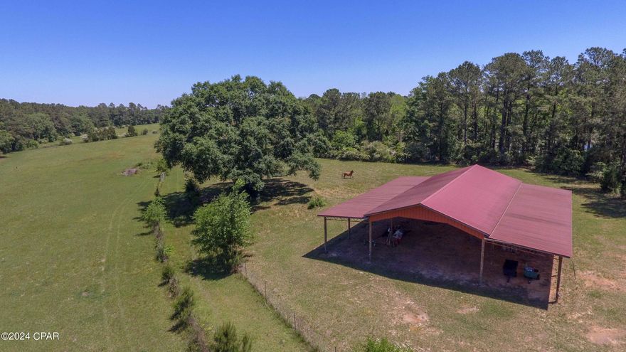 Gorgeous 17 MOL Acre Tract in Northern Holmes County. The property boasts a large 60'x58' barn that offers ample room for equipment and hay storage. The barn is already wired for electricity as well. The fields offer fencing and cross fencing, making this property horse and cattle ready. Located approximately 1 Hour from Panama City Beach and less than 45 minutes from Dothan, AL, this piece not only offers room to play, but incredible location as well. Schedule your showing today!