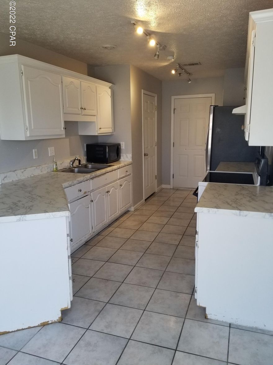 Excellent investment opportunity or great starter home! Cute 3 bedroom, 2 bath with large back yard. Very convenient to Tyndall and schools.