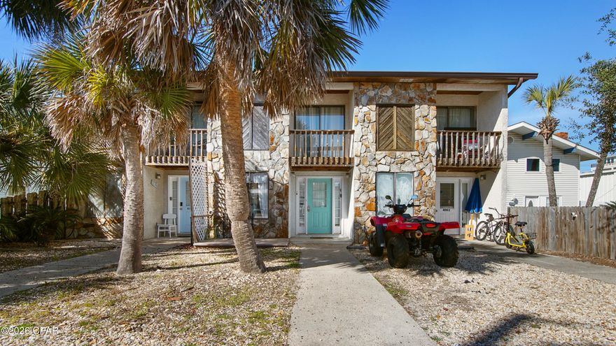 Just 350 feet from the beach, this irresistible coastal townhome invites you to live the laid-back seaside lifestyle you've been dreaming of. Sold fully furnished, turn-key, and with no HOA, it's ready for immediate enjoyment—simply arrive with your bathing suit and toothbrush. Inside, beach-cottage charm meets effortless comfort, with an open-concept living space, an oversized kitchen, and a cozy dining area perfect for relaxed gatherings after a day in the sun. The primary bedroom offers a serene retreat with generous closet space and a private balcony overlooking the backyard, while the guest bedroom features its own attached balcony for morning coffee or sunset breezes. With an additional half bath, outdoor laundry, and close proximity to sugar-white sand, dining, shopping, and local attractions, this property also shines as a highly desirable vacation rental, making it an ideal blend of personal getaway and income-producing coastal escape.