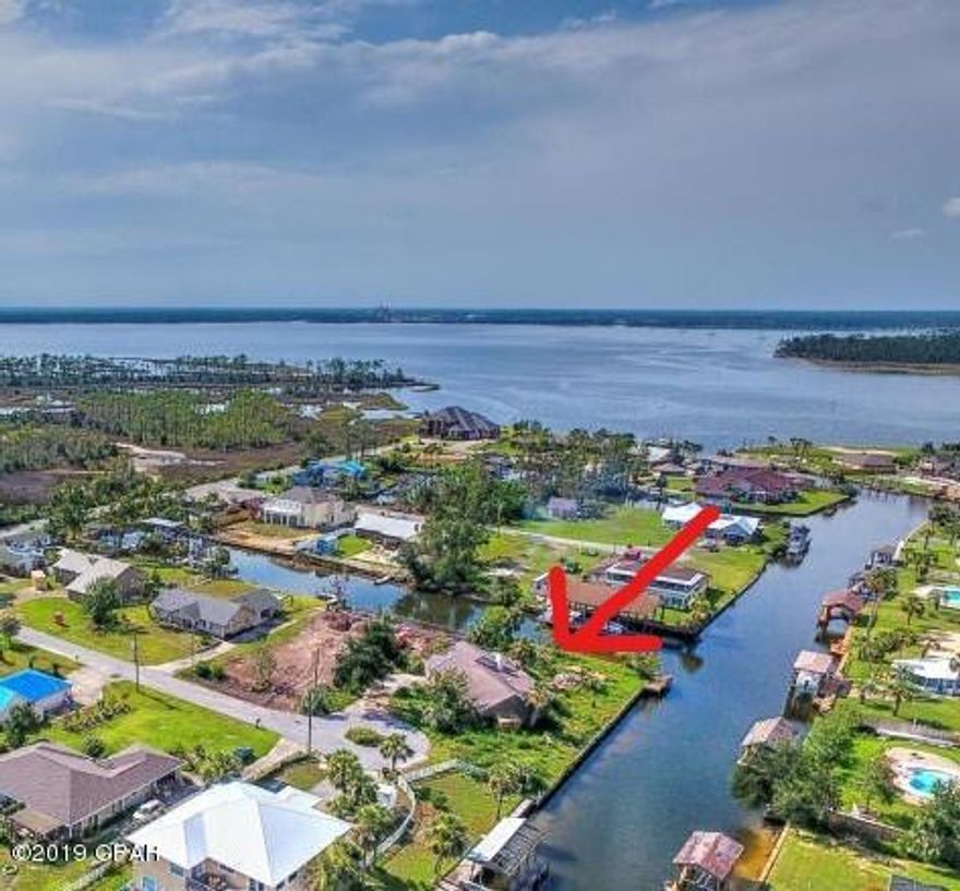 Calling all waterfront and boat lovers! Over 250 square-feet of waterfront canal footage with access to the Gulf. This home was damaged by Hurrican Michael. The value is in the land. Property has septic and well. Please verify all dimensions if important.