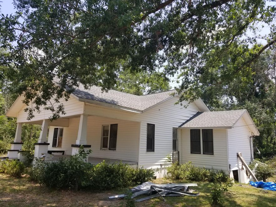 Seller will sale the house with 1 acre of land if buyer wants to purchase just the house. Seller will have the 1 acre surveyed to divide and establish a new tax ID. New asphalt roof installed due to storm.