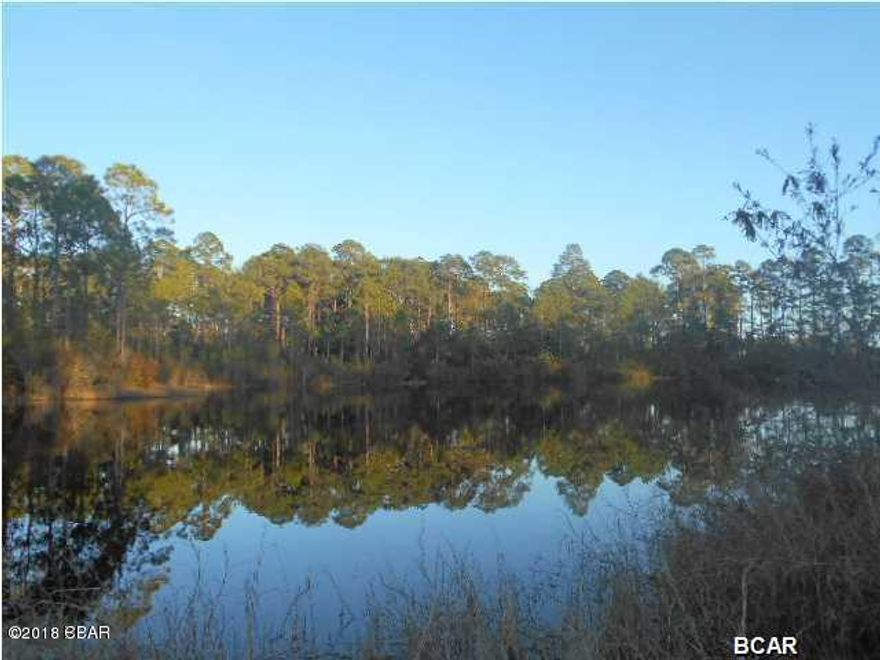 Laird Point is a beautiful waterfront community. This one-third acre  lakefront lot, so plenty of privacy and waterway pleasures for those who delight in nature's coastal beauty. Laird Point subdivision features a double tennis court. This one is on the lake and has a beautiful view. Hurry this one will not last long at this attractive price.