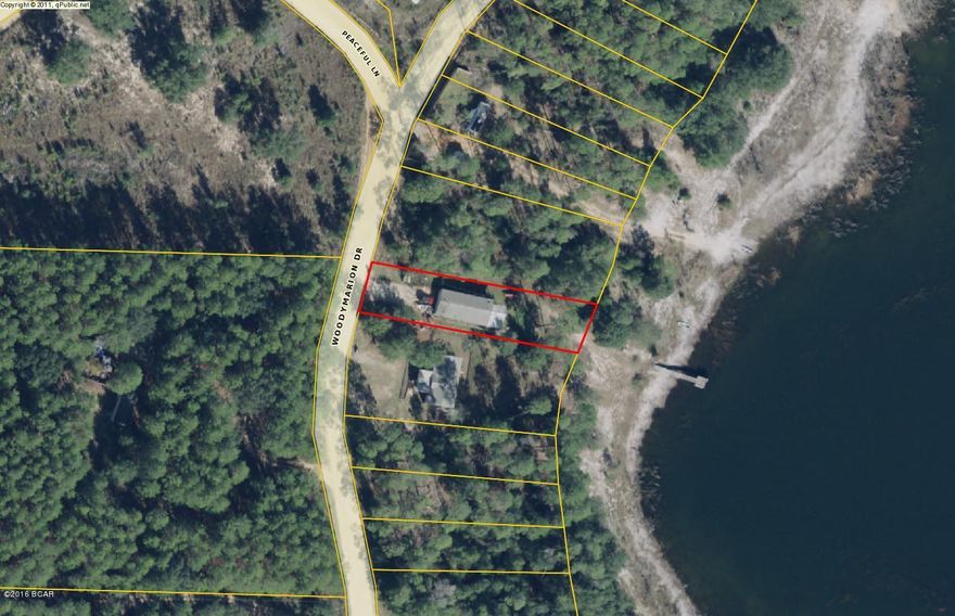 Waterfront! Opportunity to own a waterfront property for less than $65,000! 3Br/2Ba mobile home with a dock, sitting area, large lot, and metal roof.  Only 20 minutes to Panama City and the World's Most Beautiful Beaches!! Come put your personal touches on this gem and get ready to catch some fish!