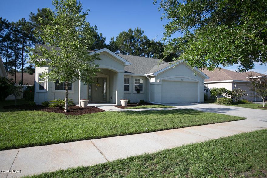 Move-in ready, over 1800 S.F. home in desirable Hammocks subdivision, located in a less traveled area of the neighborhood. Spacious great room with vaulted ceiling, formal dining room, eat-in kitchen, and covered rear porch makes for a place you will gladly settle in and want to call ''home.''  Roomy 18 x 12 master bedroom offers private access to rear, covered porch, while the master bath offers his and her walk in closets and double vanities. Home also provides recently installed wood floors,quality stainless steel appliances, and upgraded brushed nickel lighting fixtures and hardware.  Freshly painted inside and carpets just cleaned.  Community pool and recreational facility, and close to quality schools. Measurements and info are considered reliable, but not guaranteed.