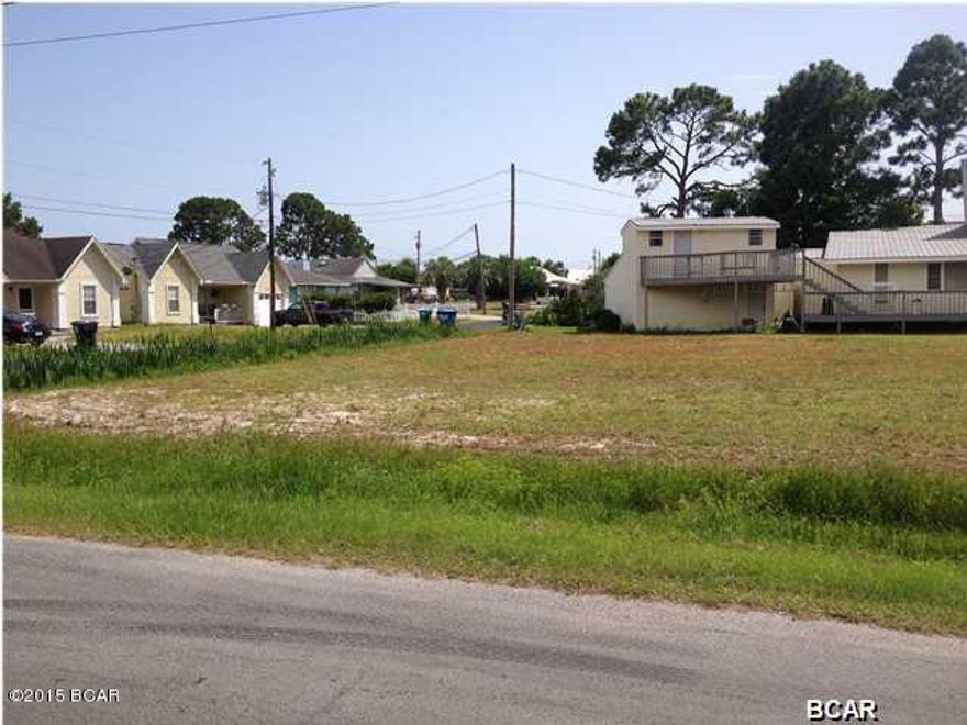 Corner lot, cleared, leveled and maintained in developed neighborhood. R-2 zoning, can place 2 single family homes here or 4 rental units. One block to public boat ramp on Grand Lagoon, with access to the Gulf of Mexico. Three block walk to the beach and ocean front. Short distance to beauty of St Andrews State Park, Navy Base and amenities of dining and shopping along Thomas Dr. Perfect for retirement or excellent rental income location, or site for single family home.