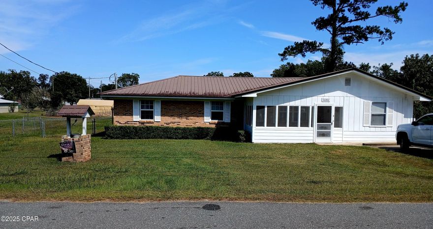 CURRENTLY UNDER CONTRACT, SELLER WILL CONSIDER BACKUP OFFERS.  Very nice brick home on convenient lot in Sneads.  Home is located within 5 miles of the Sneads Park and boat ramp.  The garage was enclosed for additional family room/office or use it as another bedroom.  The second bath was also added to this addition.  Even without the garage, there is ample parking, though, with the pad out front and the concrete block tool shed in the back which has an attached carport.   This concrete block tool shed has a unique screened-in picnic area attached which is perfect for cookouts and family get togethers even in the rain!  There is also a fire pit behind the tool shed.  The HVAC (heating, ventilation and air conditioner) is less than 5 years old and the metal roof was replaced about 2010.  There is a very nice front porch waiting for quiet nights of relaxing after dinner.  You must see it!  It even has its own basketball goal in the backyard. This is the perfect home for first time home buyers.  

Washer, dryer and additional refrigerator in the utility/laundry room do not convey.  Also, the white portable outbuilding and metal pole barn in the back yard do not convey.