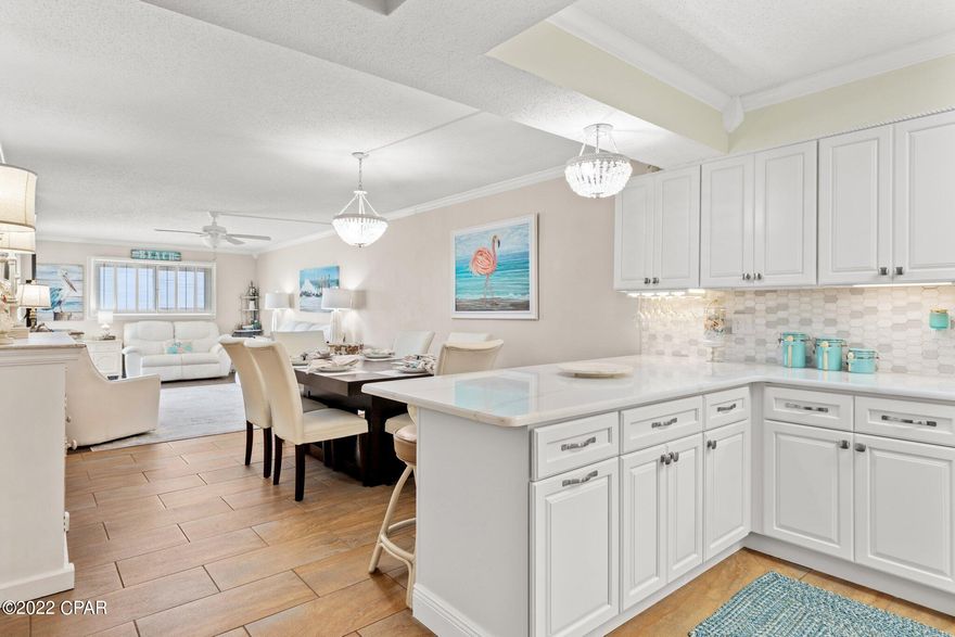 Under Contract, Seller may consider back up offers RENTAL POTENTIAL UP TO $85K! Ask your Realtor to share the rental potential with you! You will fall in LOVE with this COASTAL condo! This FULLY FURNISHED and beautifully updated 3BD/2BA Regency Towers unit is turn key with new windows & doors, new water heater & brand new AC unit.  The kitchen is IMMACULATE with new QUARTZ countertops, ceramic tile backsplash, large farmhouse sink, soft close cabinets with sea glass doors, instant hot water faucet, complete with a COFFEE NOOK & WINE RACK!  Sit back relax and enjoy breathtaking SUNSET VIEWS from your west facing balcony or treat yourself to a cocktail at the beachfront POOLSIDE tiki bar.  Year round community ACTIVITIES for ALL AGES.  Regency Towers is the FUN condo! Regency Towers boasts two large pools one heated year round, a full service tiki bar & grill, convenient mart, indoor hot tub with bathrooms, kiddie pool, outdoor showers, exercise facility, billiards room, multiple picnic areas with grills, and plenty of in house activities offered year round!  Nearby St. Andrews state park and boat launch, plenty of restaurants, shopping, waterpark, jet ski/boat rental and more!