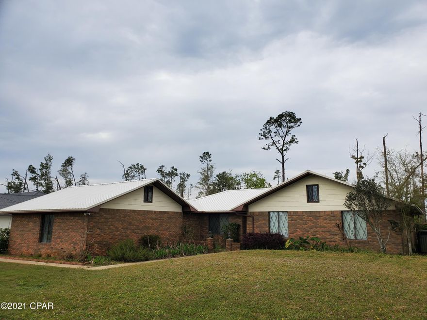 CURRENTLY UNDER CONTRACT. Sellers taking backup offers. Featuring an all Brick 4 bedroom, 2 bath home on a well established street in Panama City.  This home has an updated kitchen with granite counters, stainless appliances and a mobile Island. There is a breakfast room and a formal dining room.  The living area has a beautiful wood burning fireplace and a screened porch to the rear of the home.  The back yard is fenced with a privacy fence for the kids and pets to play safely. Double garage, and a 30 amp hook up for a motorhome in the driveway. Also water filtration system and outside shower. Call your Realtor today for an appointment to see this awesome home!  If dimensions are important please verify.