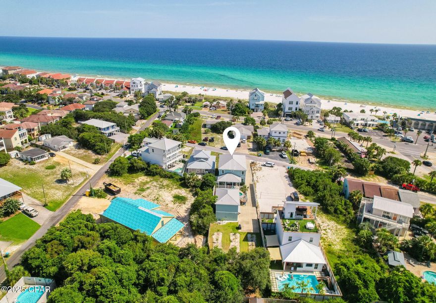 Welcome to a one-of-a-kind beach retreat located on the highly sought after west end of Panama City Beach, south of Highway 98. Now priced over $200,000 below the previous list, this unique coastal estate delivers exceptional value and versatility. Whether you're searching for a full time residence, a second home, or a high performing vacation rental, this property offers a rare opportunity just a short walk from the sugar white sands and turquoise waters of the Gulf. Thoughtfully designed for comfort, space, and income potential, the property includes a spacious main home, a detached carriage house, a private saltwater pool, and even a citrus garden oasis tucked beneath mature oak trees. The main home spans 2,184 square feet and features 4 bedrooms and 4 full bathrooms, including two primary suites (one on each level), each with spa like en suites and generous walk in closets. The open concept layout flows seamlessly from a sun drenched living room into a chef's kitchen outfitted with solid wood cabinetry, granite countertops, stainless steel appliances, and a large breakfast bar. A dedicated dining area offers plenty of room for entertaining. Upstairs, enjoy a bonus living area with a wet bar that opens to an oversized 350 square foot covered balcony, complete with Gulf views and a built in porch swing, perfect for your morning coffee or sunset lounging. Quality finishes like porcelain tile and wood floors run throughout, adding timeless appeal. Outside, your private saltwater pool with tanning shelf invites you to relax or entertain in style. The surrounding deck has been recently resurfaced, and a covered grilling station makes it ideal for poolside gatherings. An outdoor shower provides convenience after a day at the beach or by the pool. Tucked behind the pool, the 660 square foot Carriage House includes a full kitchen, living and dining areas, 1 bedroom, and 1 full bath, perfect for guests, extended family, or short term rental income. It sits above a large two car garage with private bays and additional storage. (Golf cart not included, but negotiable.) A hidden gem of the property is the lush citrus garden, which produces lemons, limes, tangerines, blood oranges, grapefruits, and more. Shaded seating areas beneath the trees create peaceful corners to unwind year round. This is a rare offering in one of Panama City Beach's most desirable pockets, brimming with amenities, income potential, and priced to move. With seller financing available and terms that can be tailored for long term investment success, this retreat is a win for both lifestyle buyers and investors. Schedule your private showing today, opportunities like this don't last long.