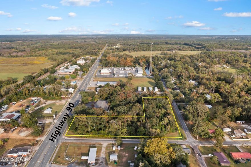Located directly off Hwy 90 this 2.987+/- acres has endless development opportunities! Property is mainly wooded, has an average daily traffic county of 6,100 (2021 DOT Data) and accessible from Hwy 90, Orange Street and 1st Ave.