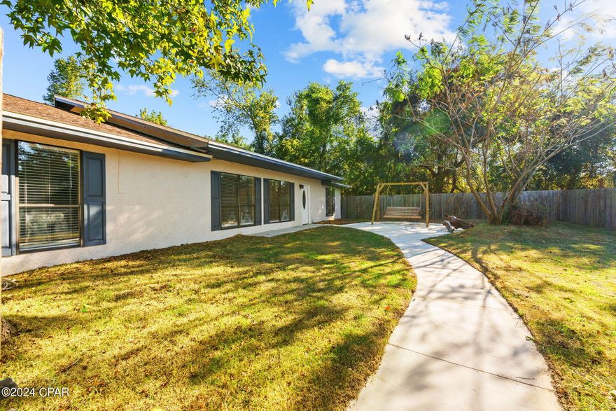 UNDER CONTRACT, SELLER WILL CONSIDER BACK UP OFFERS. This recently updated 4-bedroom, 3-bathroom property sits on just under 1.5 acres and offers an incredible mix of space, comfort, and modern amenities. Enter inside and be greeted by the bright and airy living room with vaulted ceilings.  The floor plan flows effortlessly from the living room into the remodeled kitchen, which is a cooks delight with brand-new cabinets, granite countertops, and sleek stainless steel appliances. You'll love the smart layout that provides both comfort and functionality, including a mudroom for easy transitions after outdoor activities, breakfast room off the kitchen, and Florida room. 

The spacious primary bedroom is a true retreat, designed with handicap accessibility in mind. It features widened doorways and an attached bonus room, perfect a nursery, second closest, or additional living space. The ensuite bathroom is features a roll-in shower and widened doorways. The additional bedrooms offer flexibility for family, guests, or a home office. Throughout the home, new light fixtures and switches brighten every corner, adding a fresh, updated feel.

Step outside to a fully fenced front yard with new sod, offering plenty of space for outdoor fun. The detached garage is a standout feature with brand-new electrical, siding, windows, a garage door, and mechanics, making it the perfect space for storage or a workshop. Plus, the property includes a spacious 16x24 shed for extra storage.

With a new patio and walkway leading up to the house, and a roof replaced in 2019, this home is move-in ready and designed for both convenience and style.Don't miss your chance to own this unique property that combines modern renovations, accessibility, and plenty of room to live, work, and play! Call a REALTOR® today to schedule a private home tour. If important, please verify all measurements.