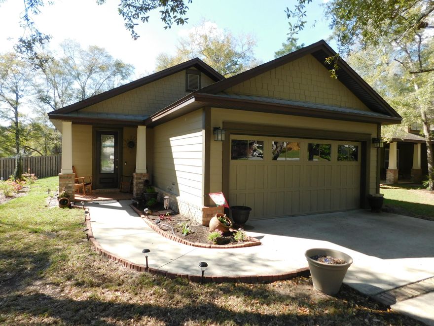 Welcome, move in ready home! This beautiful corner lot in Freeport is 25-30 minutes from the sugar white beaches, less than 10 minutes from the bay, schools and close to shopping. The back and front is nicely landscaped and offers lots of space. The privacy fenced has a double gate to store a small engine fishing boat behind the 6' fence. The open space living room is connected to the dining area. The kitchen has updated cabinets and a huge pantry. The two car garage offers space for a extra refrigerator and/or freezer. The 3 bedroom home has two full baths and tall custom made closets in each room. The master bedroom and a additional bedroom has access to the screened in porch and open patio area. The master bathroom features a double vanity, separate shower, and a jacuzzi tub to relax in after a long day of work or a day at the beach. There is also a Community pool and playground.