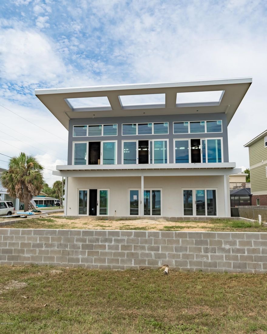 Custom Built BID-A-WEE BEACH BEAUTY! Come and experience this modern home designed and crafted by Boomerang Builders. This home exemplifies innovative and forward engineering skills, spacial brilliance, modern design, functionality  all without compromising the high quality and very cool architecture! This is not just a home, it is literally a piece of art!  The unobstructed views are seen from  the open living/kitchen area through the expansive length of windows which extend across the entire front of the home. 4 bedrooms have their own bath and there are two bonus rooms perfect for bunks.This a dream property for rental, second or primary home. This home is amazing and the location is incredible! It's right across from the sought after, Bid-A-Wee Beach. This is a MUST SEE!