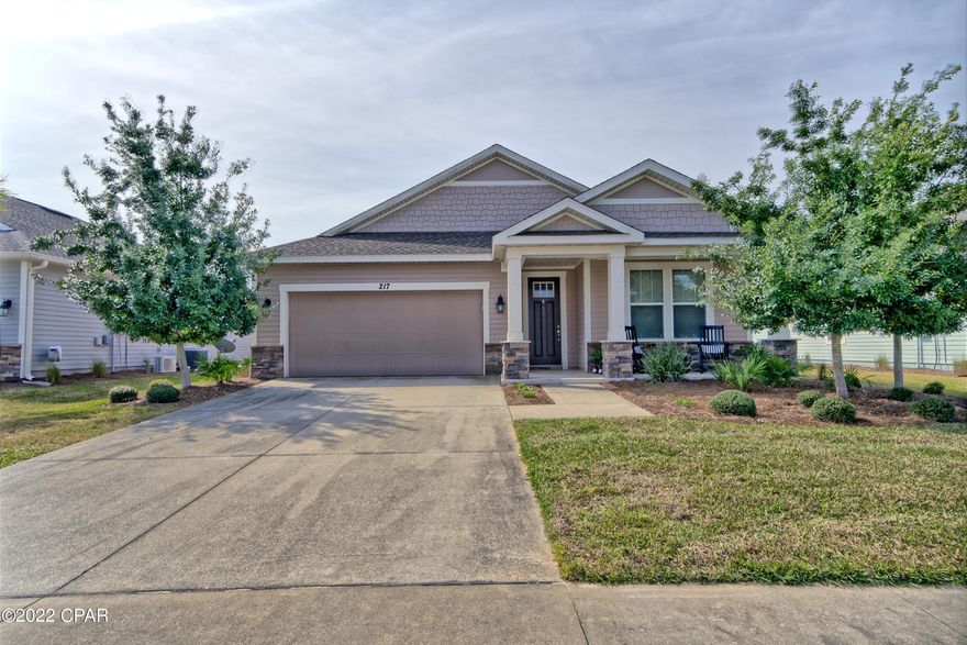 CURRENTLY UNDER CONTRACT, SELLER ACCEPTING BACKUP OFFERS Whisper Dunes is a perfect beautifully maintained  beach oasis on the West End of Panama City Beach.  This mangrove floor plan with a craftsman elevation offers a 2 bedroom and 2 full baths floor plan with a bonus room that can be used for a 3rd bedroom or office. The Kitchen features stainless steel appliances and oversized 36'' wood cabinetry with crown molding and granite countertops. Full bathrooms include raised height vanity's with tile flooring in bathrooms. There is a roomy 2 car garage.  The landscaping is included in the assessment.  The subdivision includes sidewalks, a beautiful community pool and pool cabana. Whisper Dunes is a golf cart friendly community and a short driving distance to our beautiful beaches and pier pa